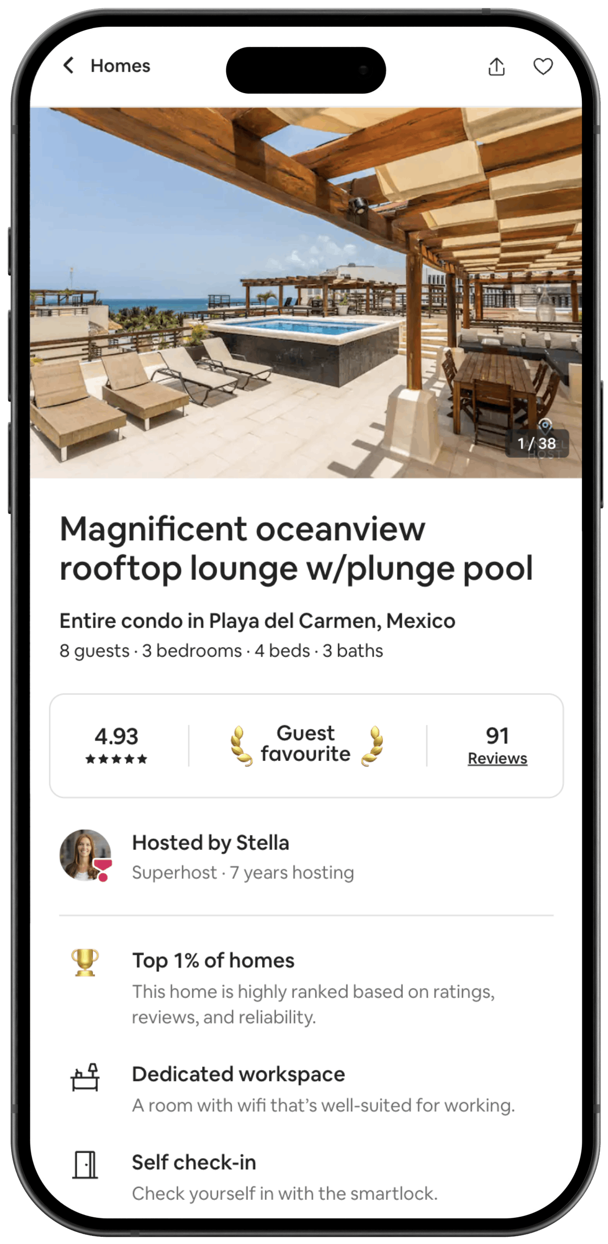 A cell phone with a screenshot of a listing on the Airbnb app