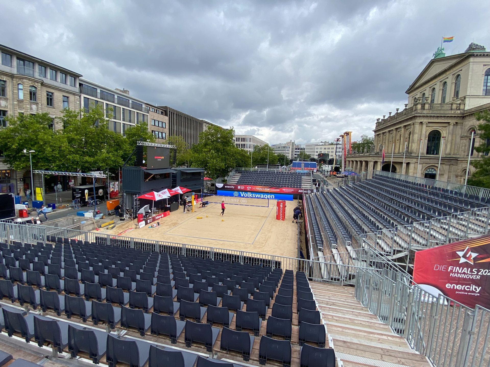Round outdoor stage with white canopy roof and tiered seating.
