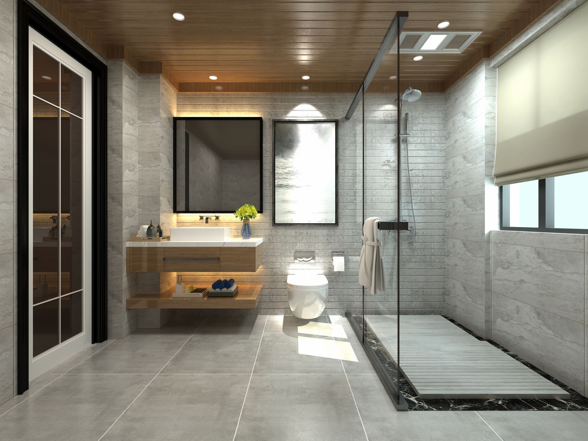 Une salle de bains moderne et minimaliste avec des carreaux de pierre grise, un plafond à lattes de bois, un meuble lavabo suspendu et une douche aux parois de verre.