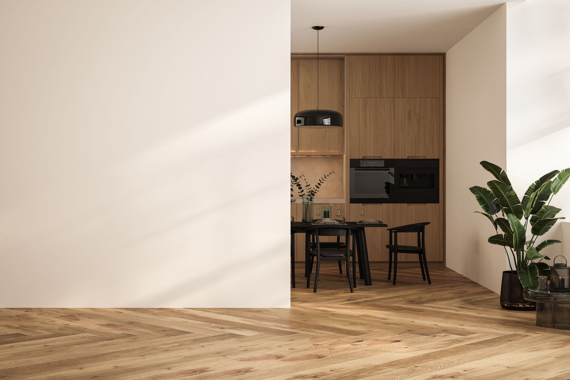 Un coin repas moderne et minimaliste avec un parquet clair, un ensemble de salle à manger en bois foncé et une plante en pot contre un mur blanc.