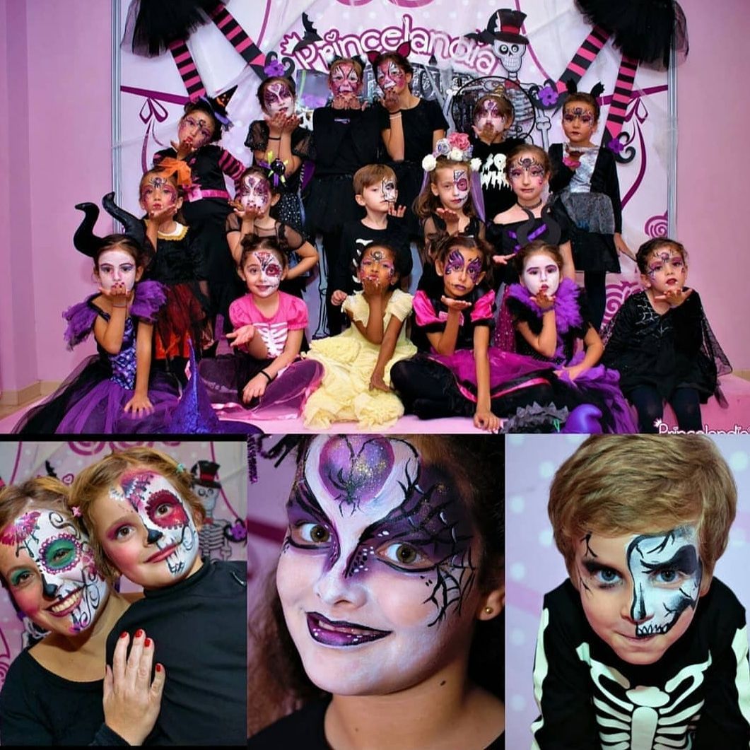 Un grupo de niños con sus caras pintadas para Halloween.