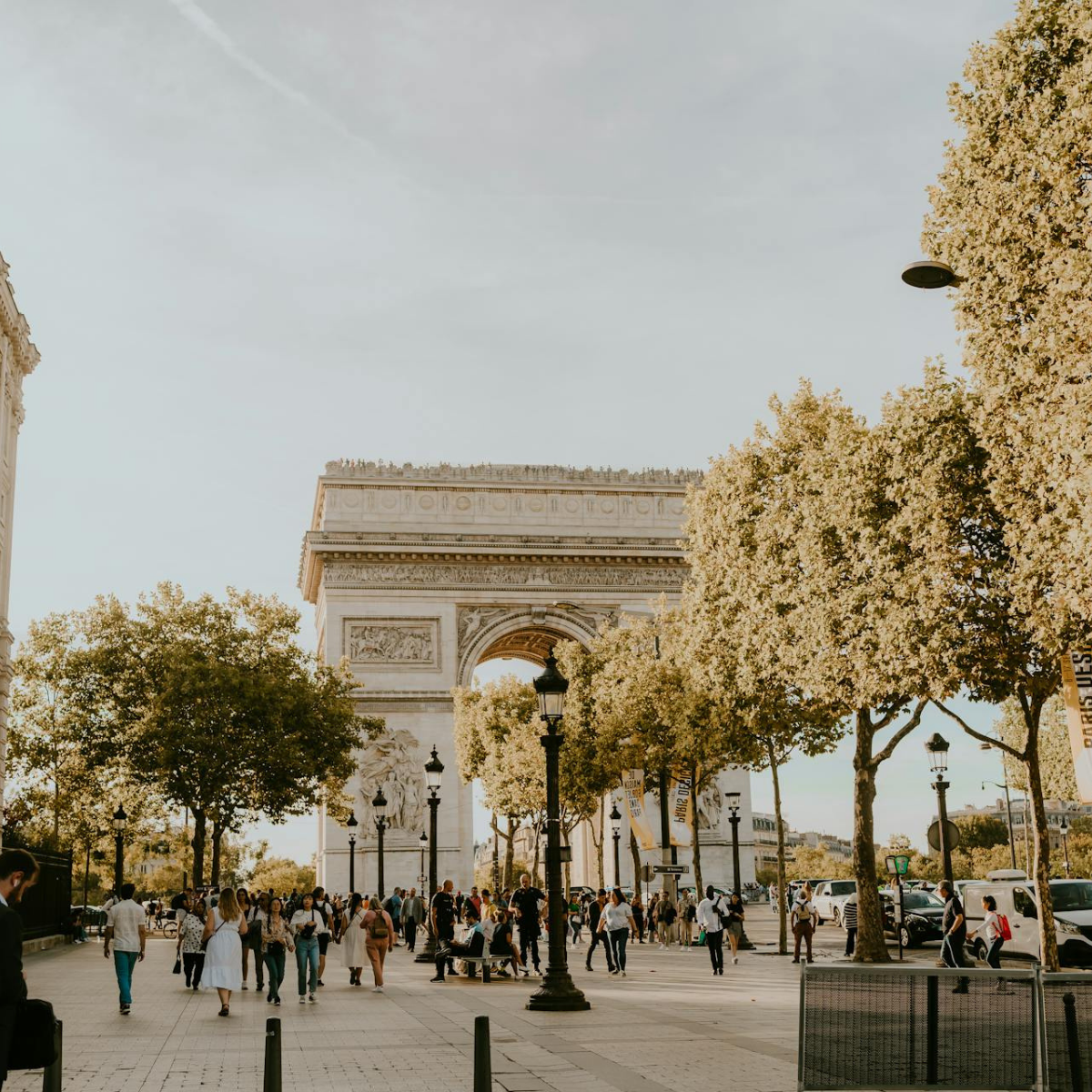 Desk with map, computer screen displaying map, coffee mug, succulent, and window view.