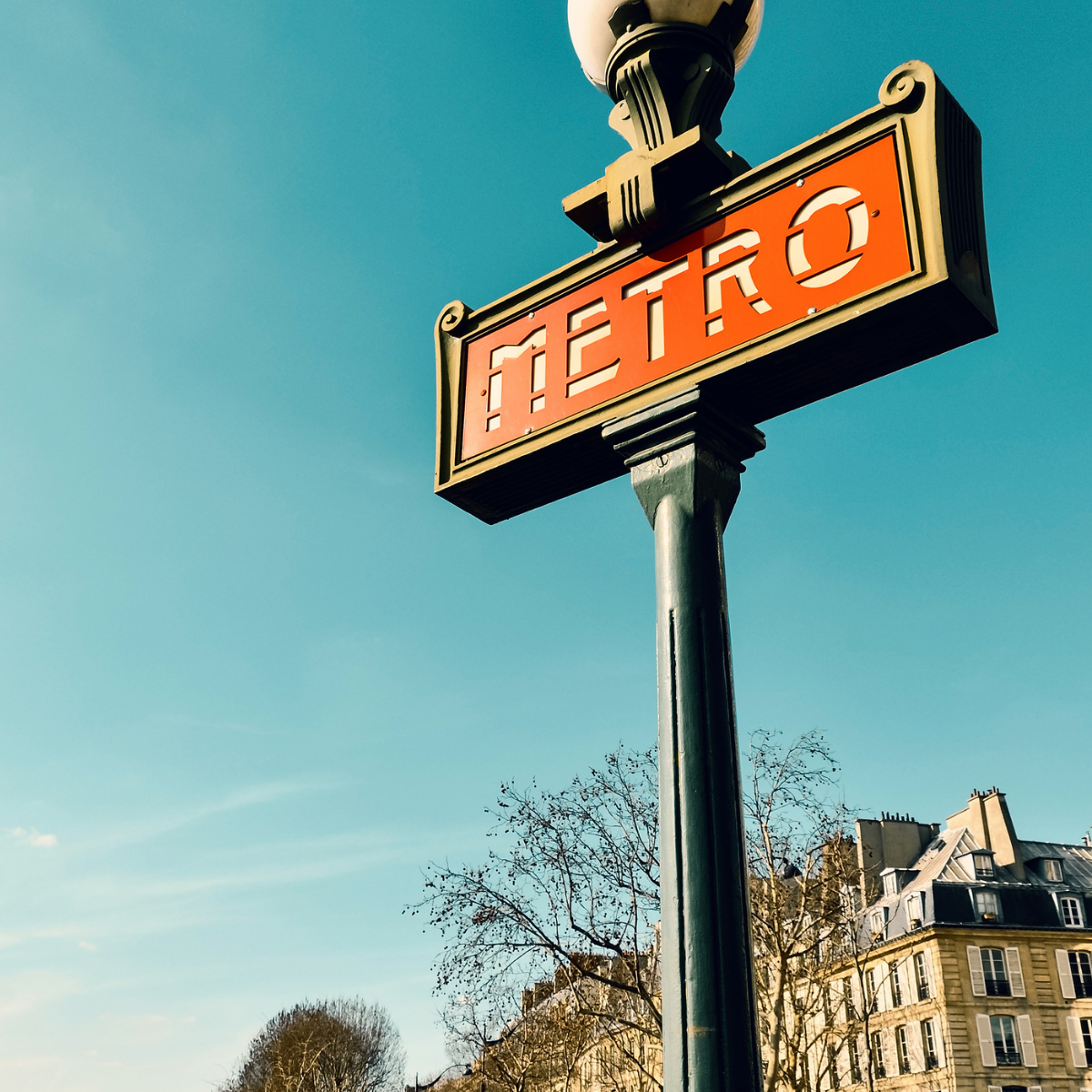 Desk with map, computer screen displaying map, coffee mug, succulent, and window view.