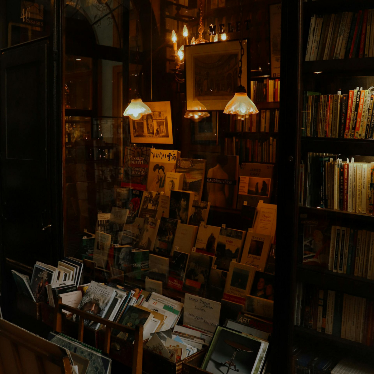 Desk with map, computer screen displaying map, coffee mug, succulent, and window view.