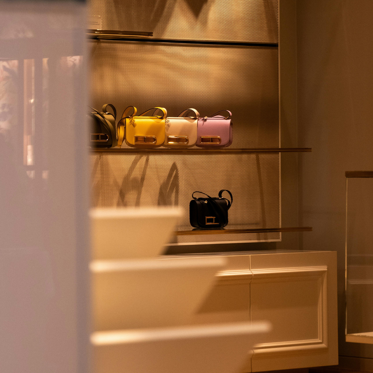 Desk with map, computer screen displaying map, coffee mug, succulent, and window view.