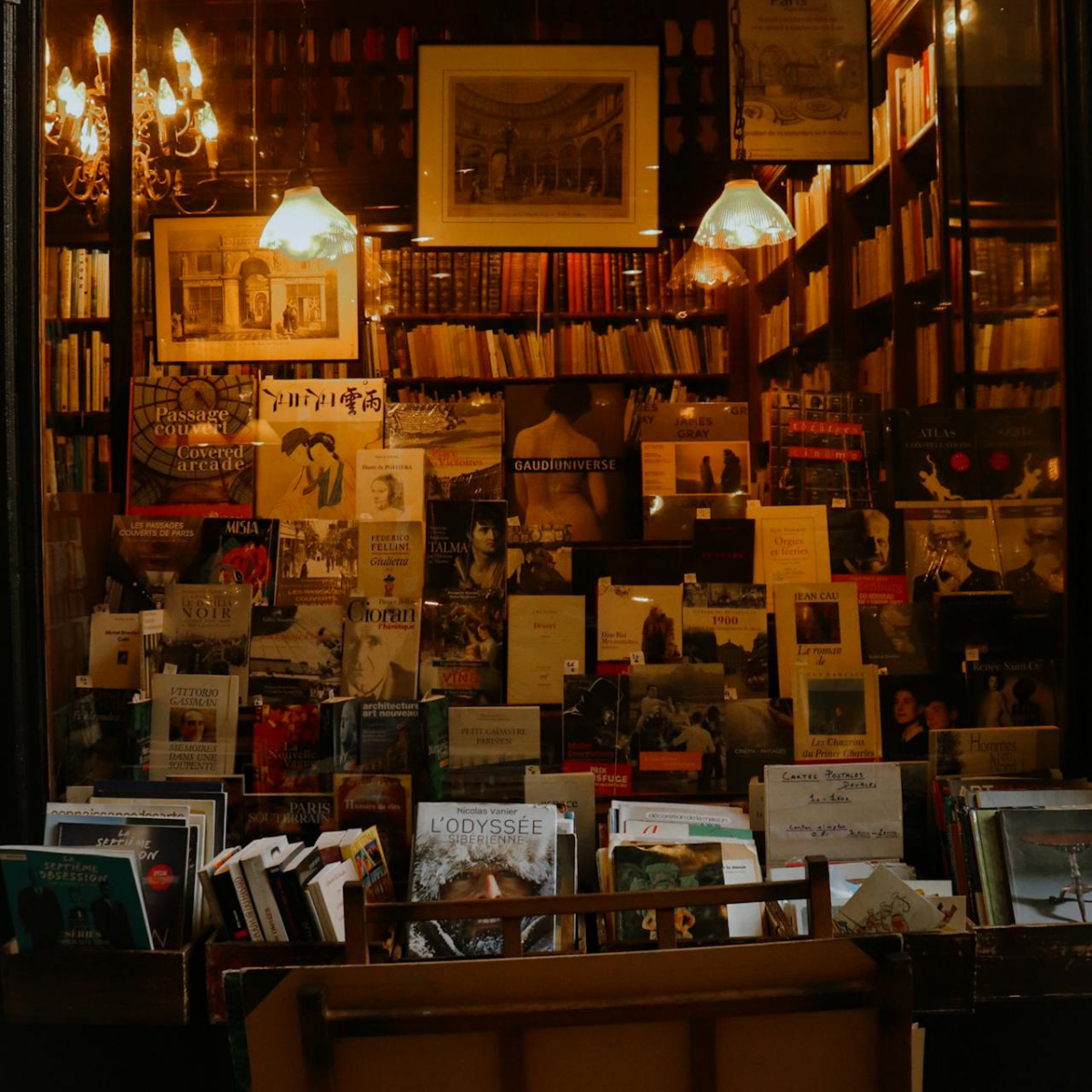 Desk with map, computer screen displaying map, coffee mug, succulent, and window view.