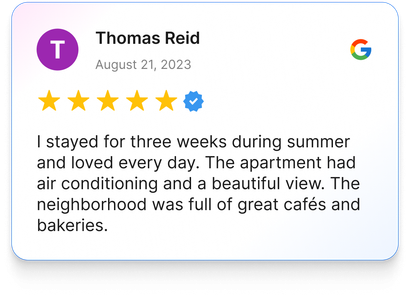 Google review by Thomas Reid: 5-star rating, apartment with air conditioning, beautiful view, and cafes.