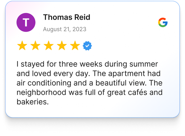 Google review by Thomas Reid: 5-star rating, apartment with air conditioning, beautiful view, and cafes.