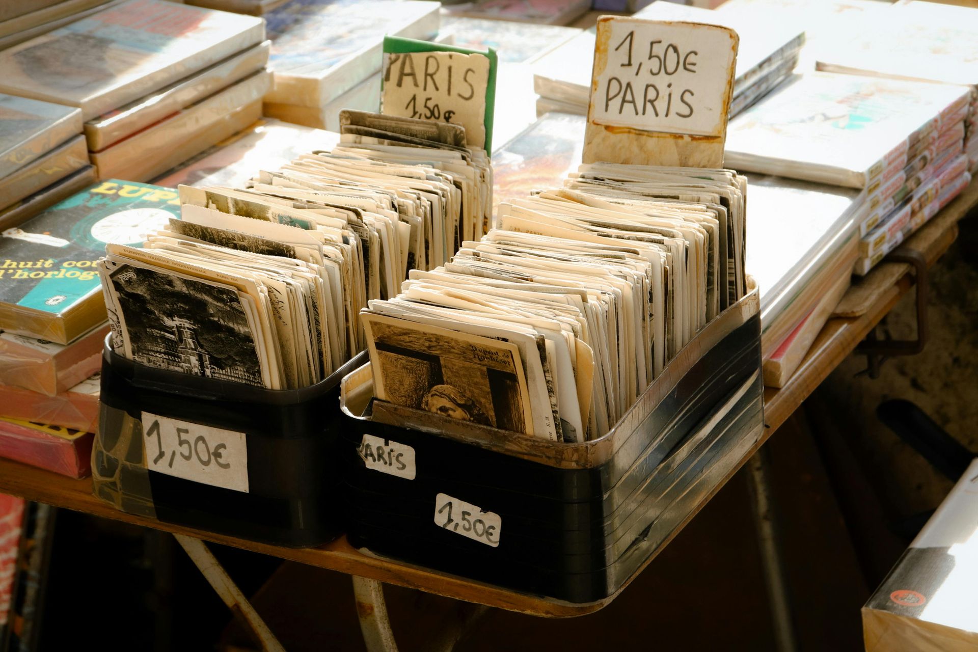 Books for sale at a Paris market, priced at 1.50 euros.