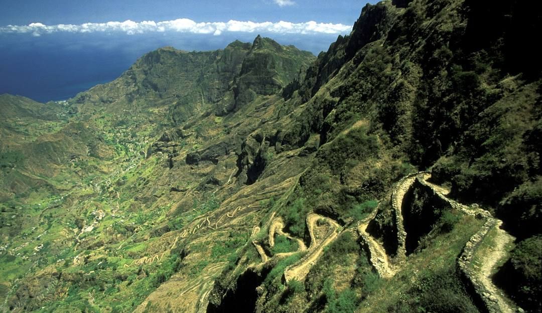 An aerial view of a trail going up a mountain.
