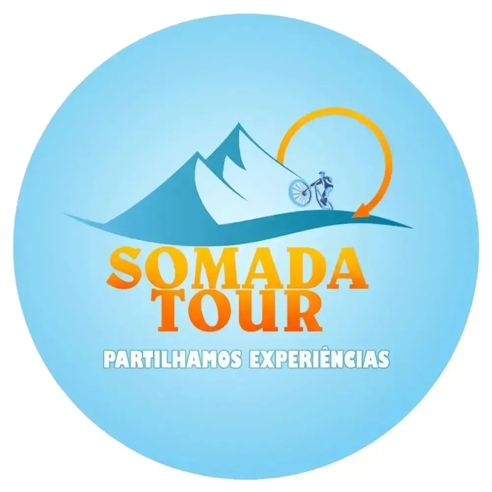 A logo for somada tour with a mountain in the background