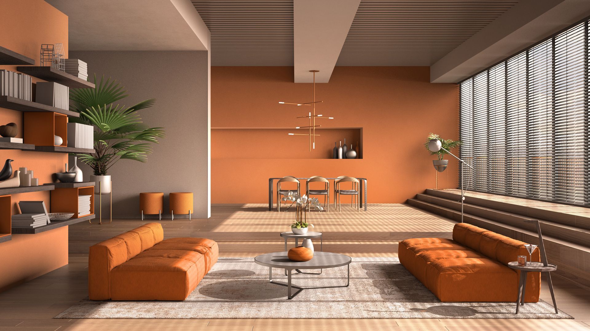 Salon moderne avec murs orange, meubles et grandes fenêtres.