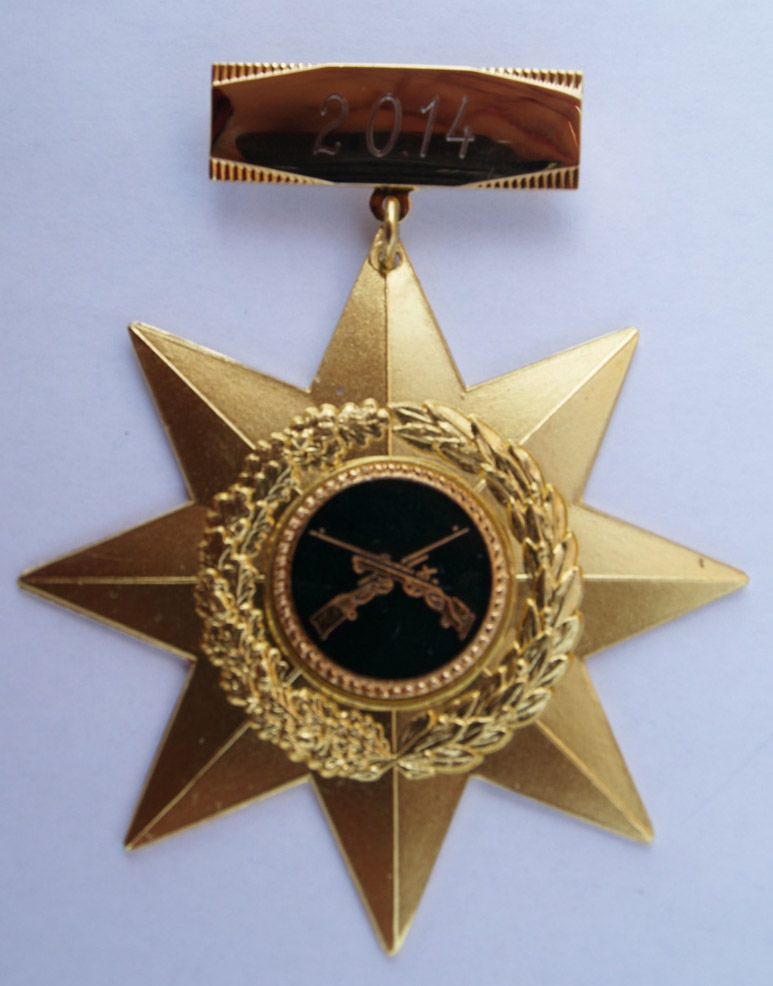 Eine Goldmedaille mit der Jahreszahl 2014