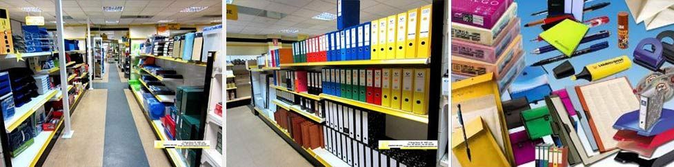 Estanterías coloridas de una librería repletas de libros y cuadernos, que muestran un pasillo luminoso y pilas de material de estudio.