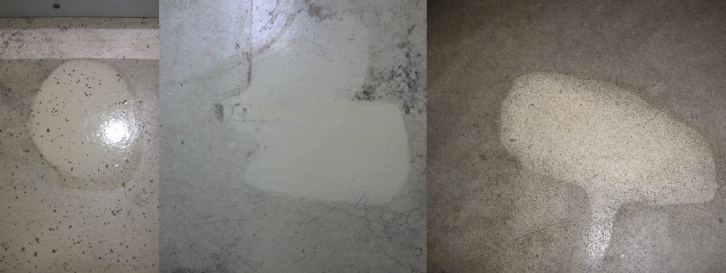 Drei liegende helle Toilettenkabinen- oder Waschbeckenoberflächen mit unterschiedlichen Flecken und Spiegelungen.