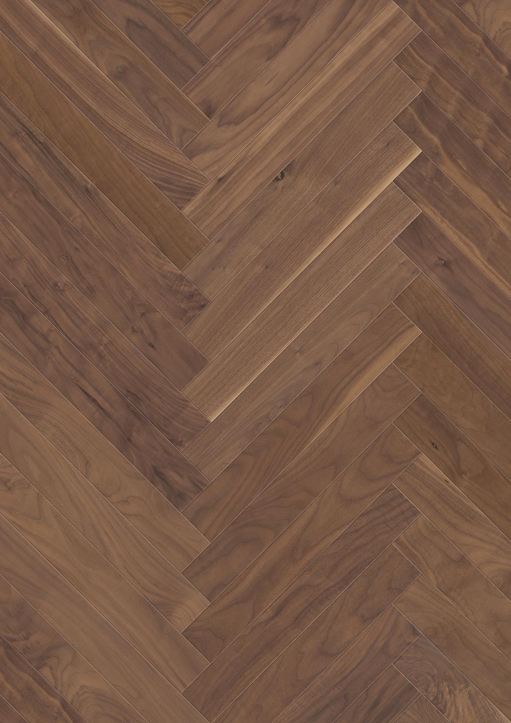 Eine Nahaufnahme eines Holzbodens mit Fischgrätenmuster.