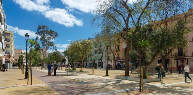 Escena callejera con árboles, edificios, peatones y cielo azul con nubes.