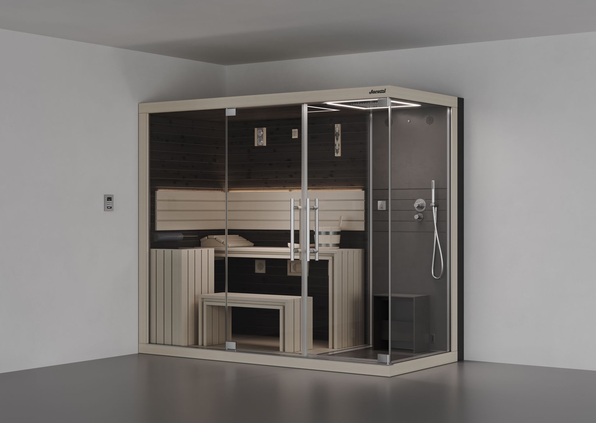 Cabine de sauna et douche combinés dans une pièce au sol gris et aux murs blancs.