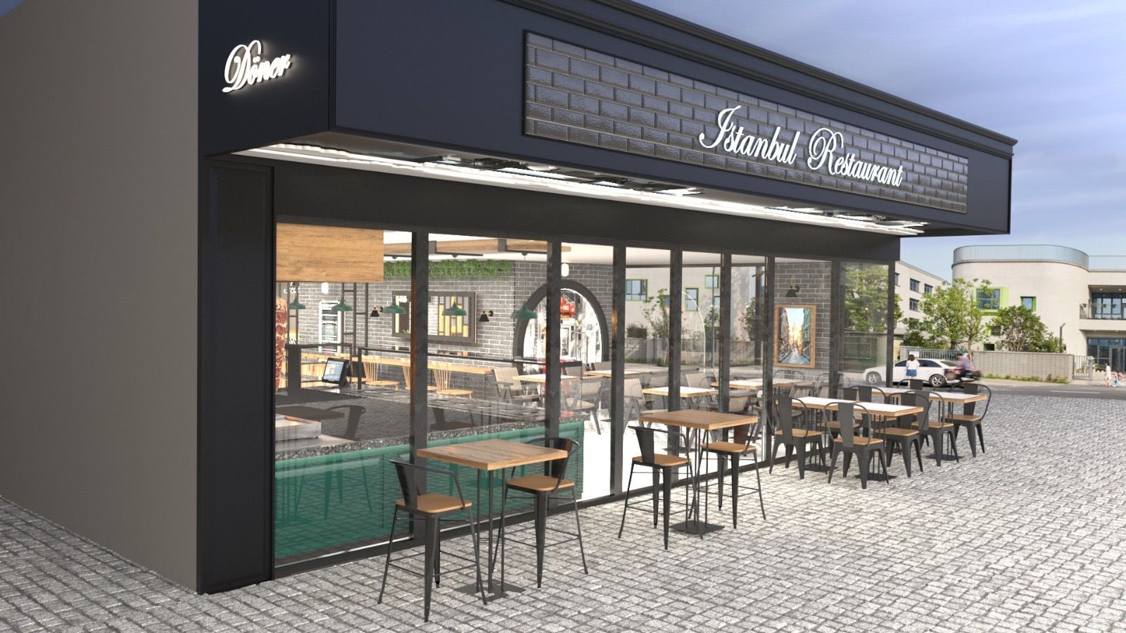 Modernes Café-Ladenlokal mit Außensitzplätzen und einer gepflasterten Terrasse