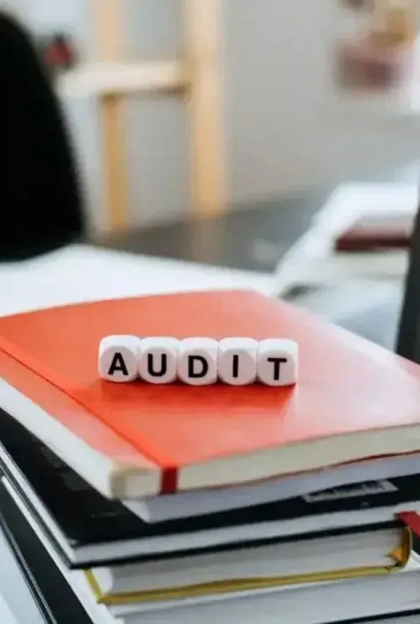 A row of black cabinets are lined up in a room.