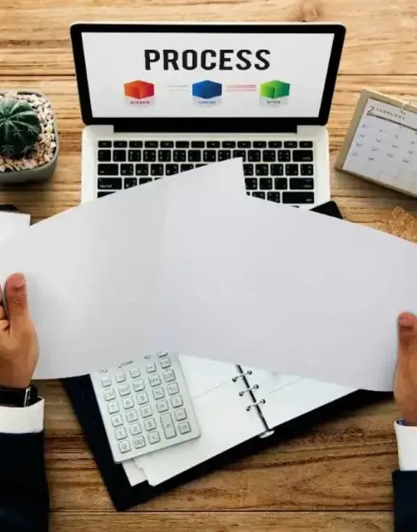 A row of black cabinets are lined up in a room.
