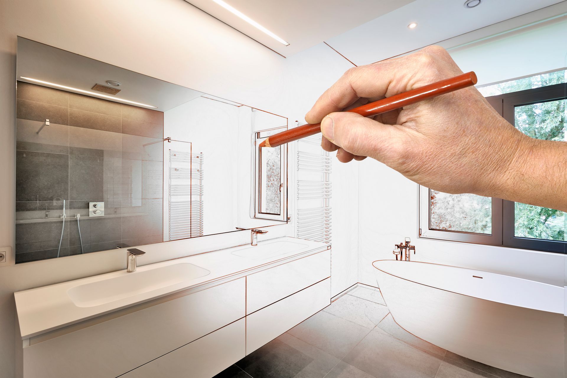 Main qui dessine un croquis de salle de bains