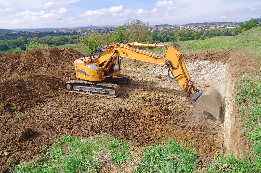 Pelleteuse en action pour travaux de terrassement
