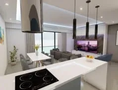 Sala de estar moderna em conceito aberto com ilha na cozinha e área de jantar.