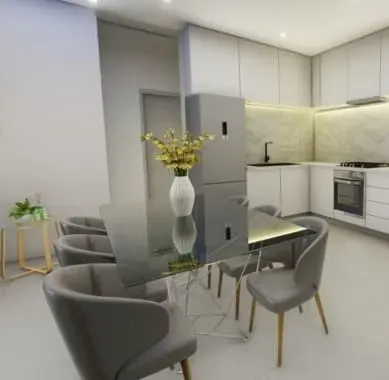 Modern dining area with a glass table, gray chairs, and a vase of flowers. 