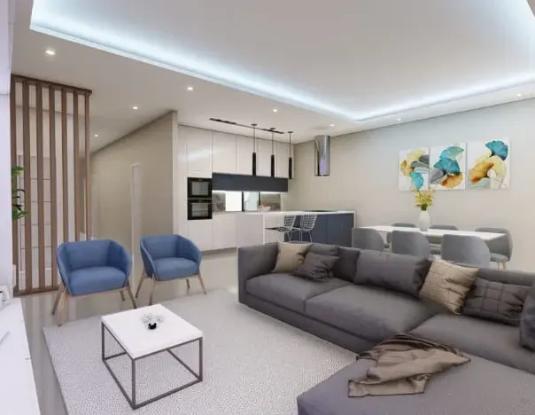 Sala de estar moderna em plano aberto com um sofá secional cinza, poltronas azuis,