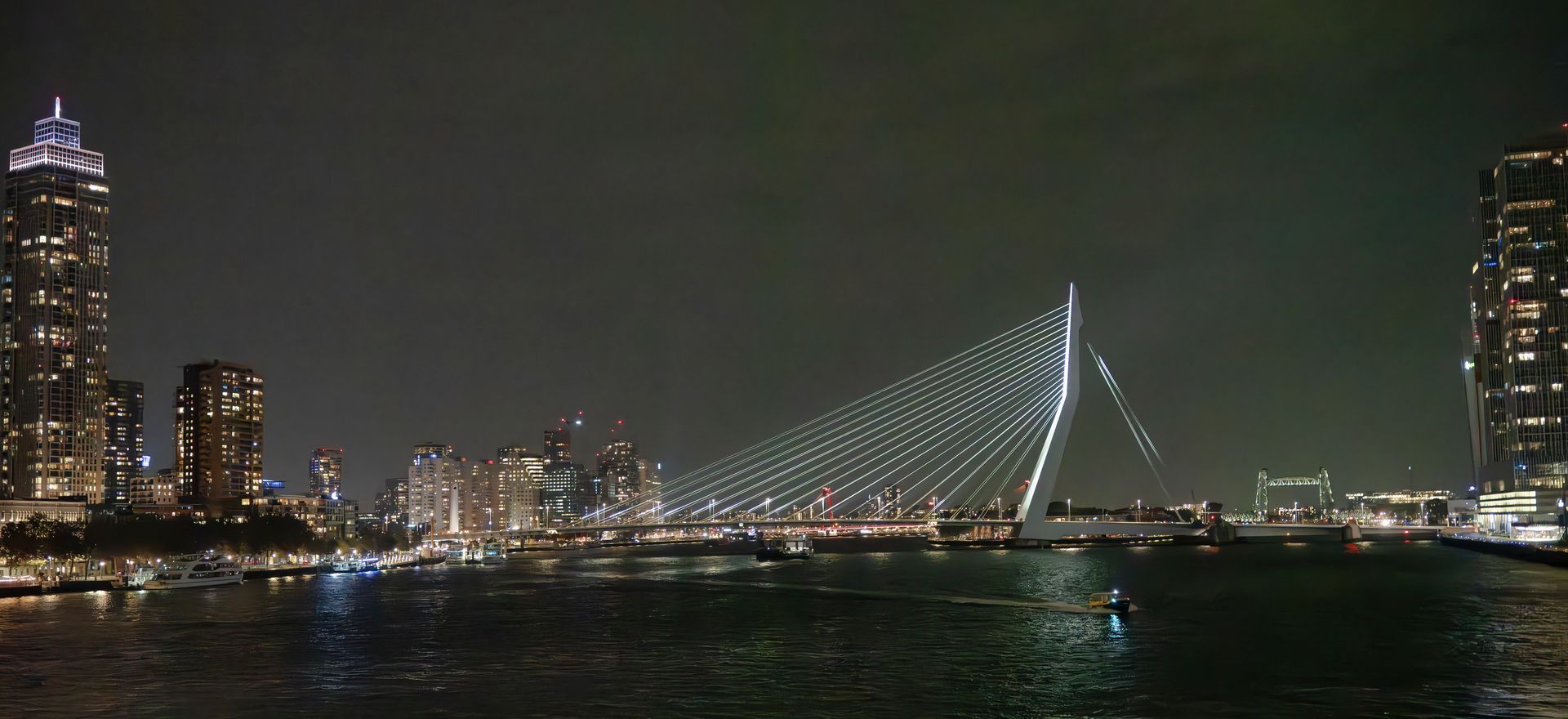 Erasmus Bridge at Night . Leaving Rotterdam with the ship Artania