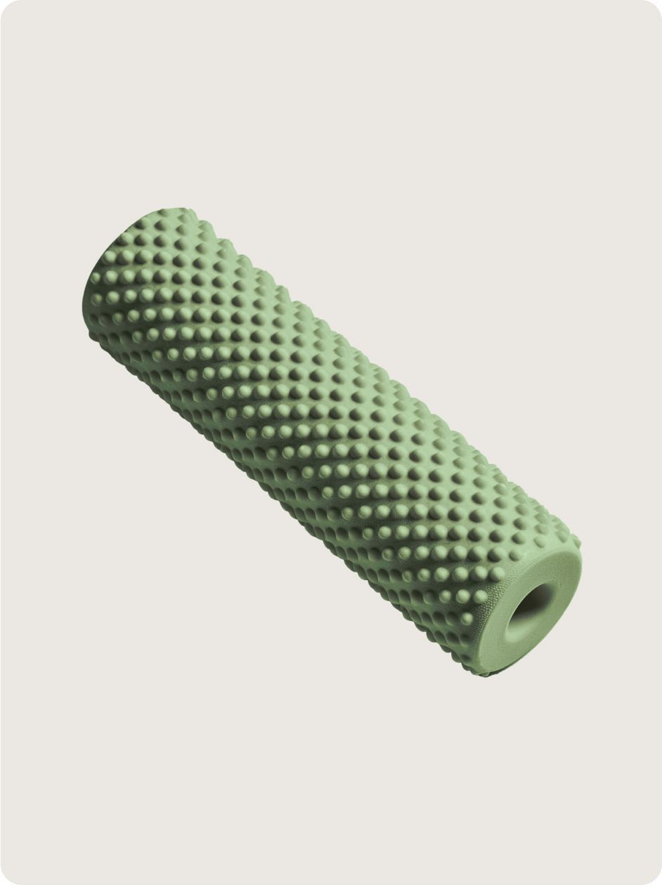 A cylindrical, sage-green foam roller with a textured, studded surface for massage and muscle recovery.