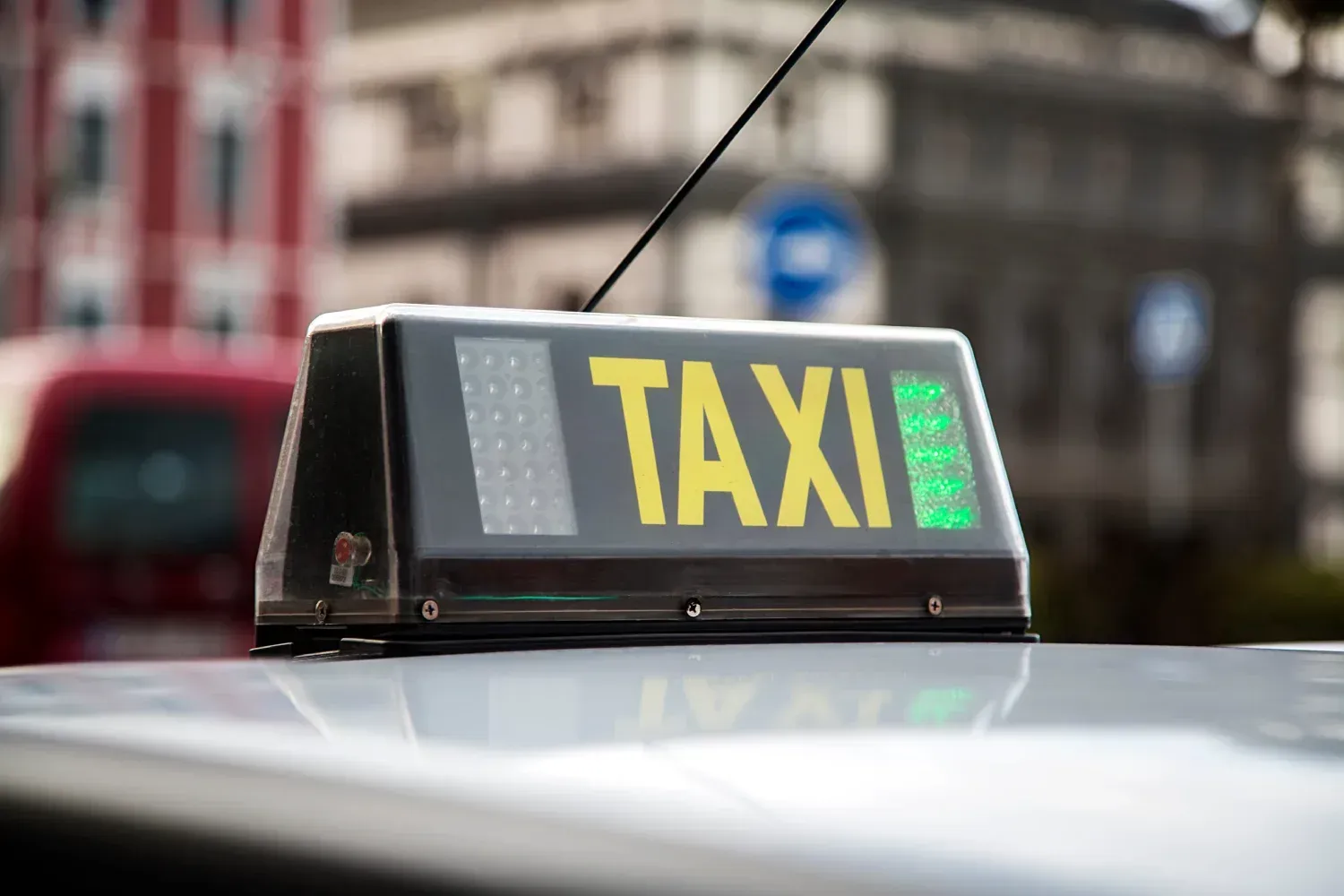 A black taxi roof sign with yellow 