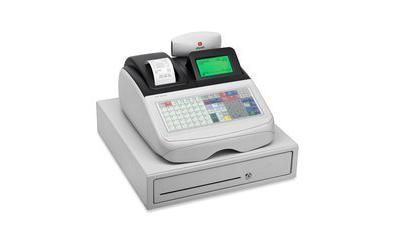 Caja registradora, de color blanco y gris, con pantalla verde y recibo impreso, colocada sobre un cajón de efectivo.