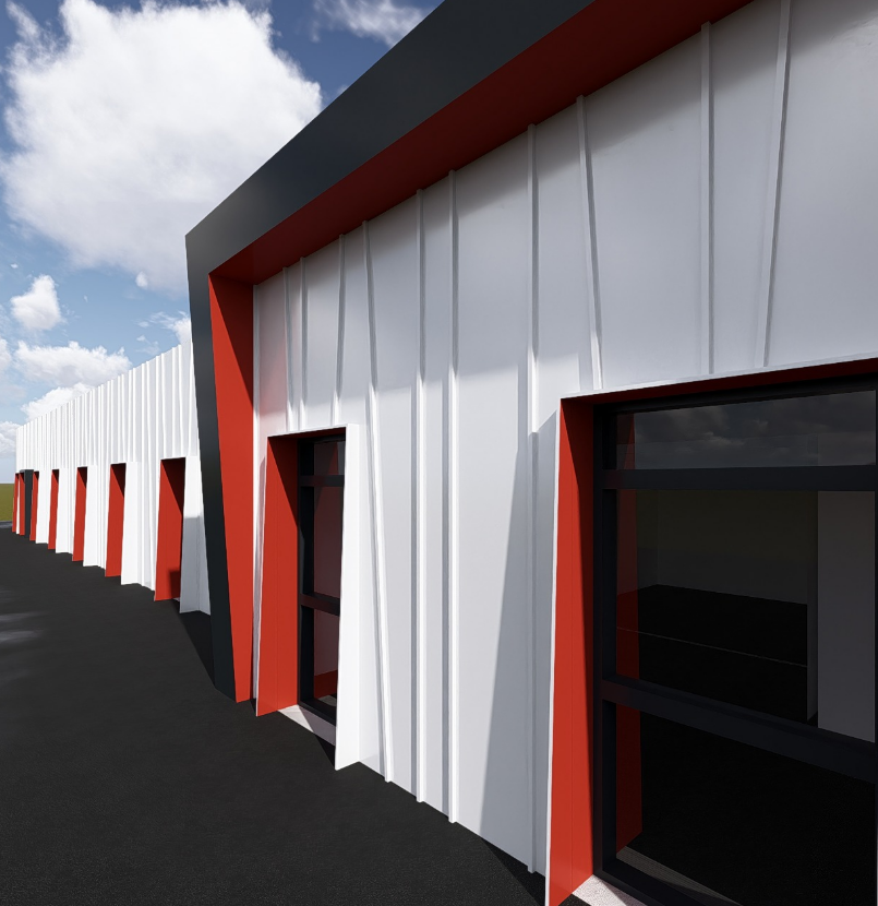 Bâtiment blanc moderne avec des touches de rouge et de hautes fenêtres le long d'une allée sombre.