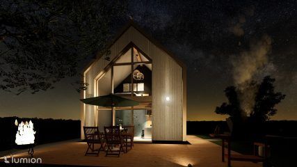 Maison moderne en forme de A, la nuit avec des lumières chaudes, du mobilier de patio et un jardin éclairé.