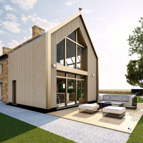 Maison moderne à deux étages avec de grandes baies vitrées et une terrasse aménagée avec un coin salon de jardin.