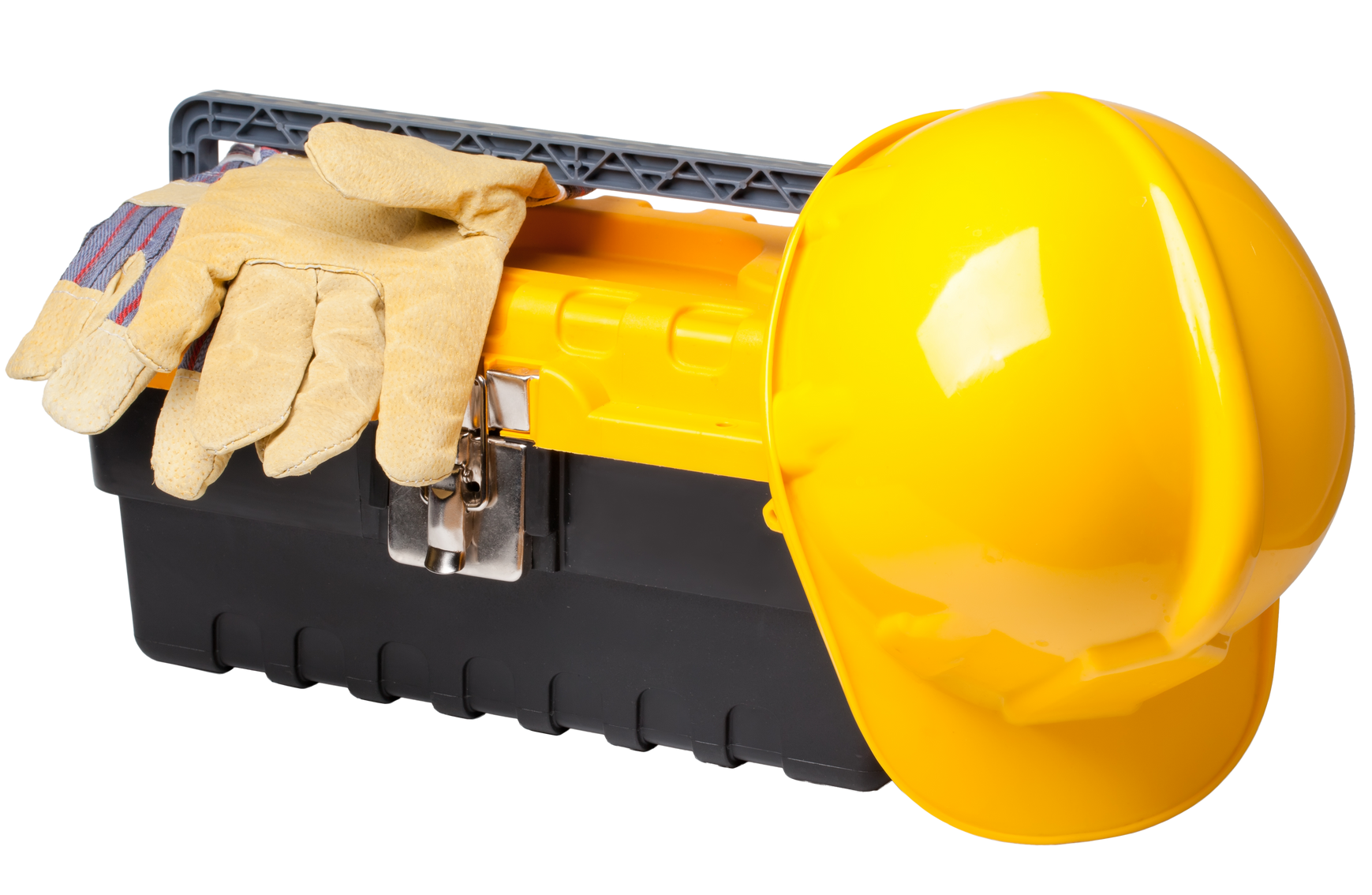 Casque de sécurité jaune et gants de travail sur une boîte à outils noire et jaune.