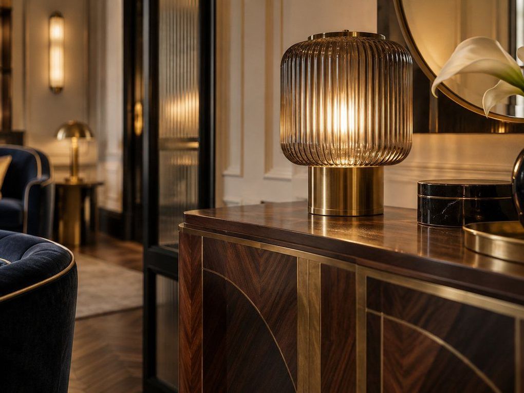 Fluted glass lamp on a veneered sideboard