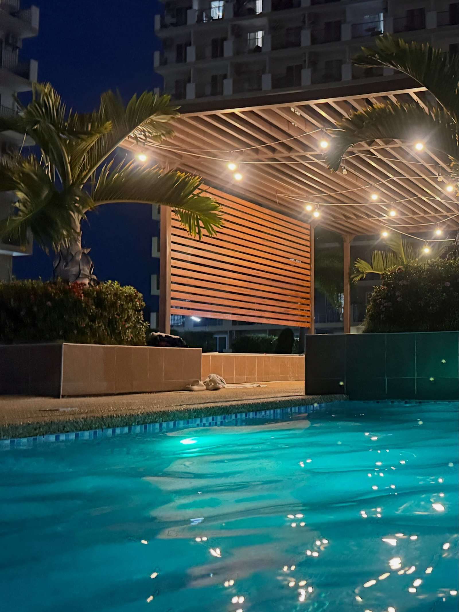The residence pool at dusk, open to Themed World guests