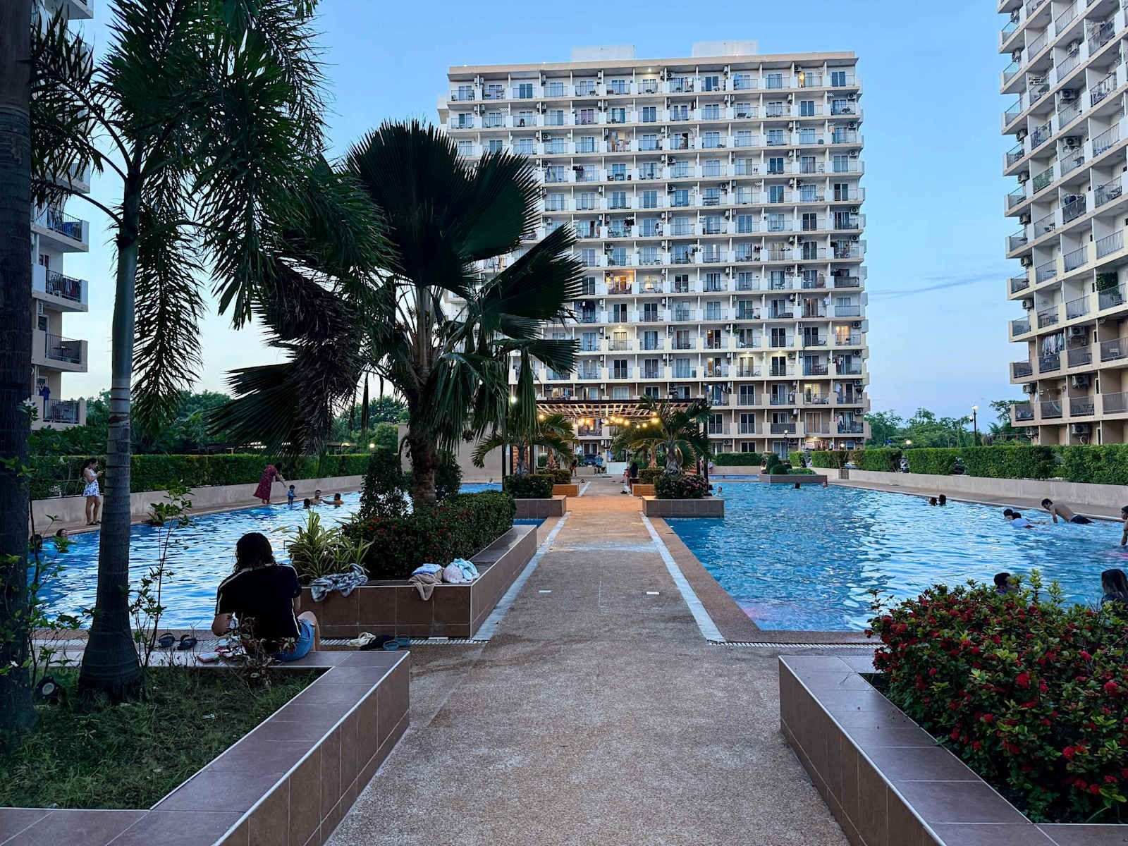 Swimming pool of the residence, floodlit after dark