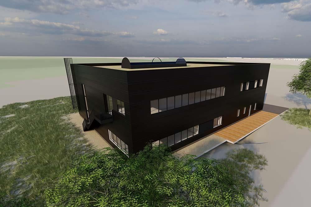 Eine Luftaufnahme eines großen schwarzen Gebäudes, umgeben von Bäumen