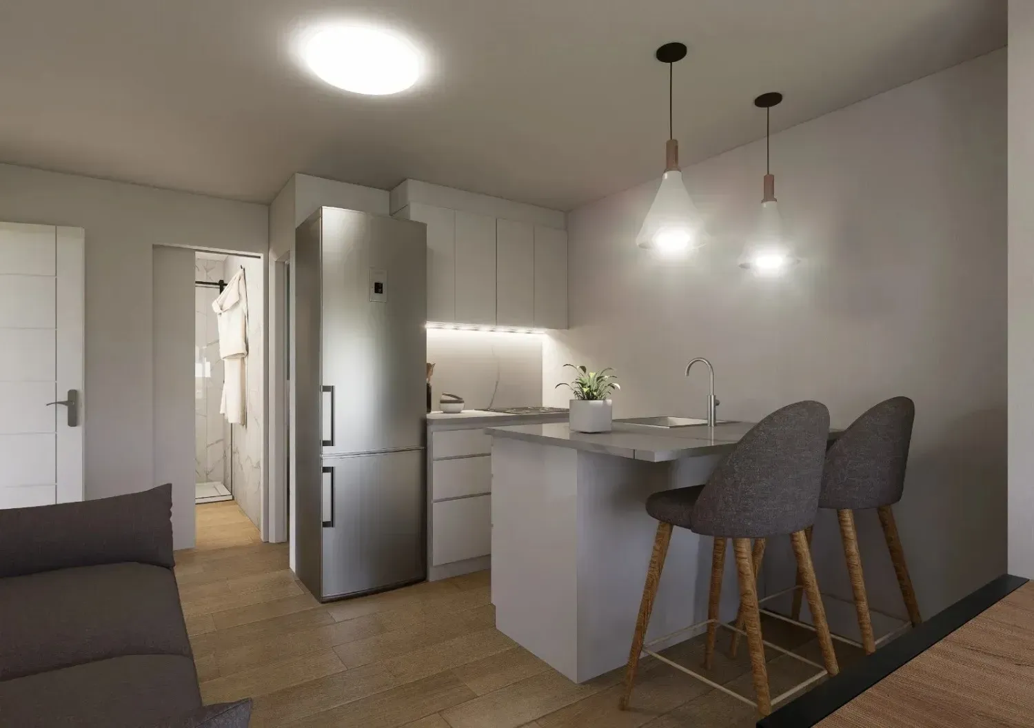 Una cocina moderna y minimalista con refrigerador de acero inoxidable, gabinetes blancos.