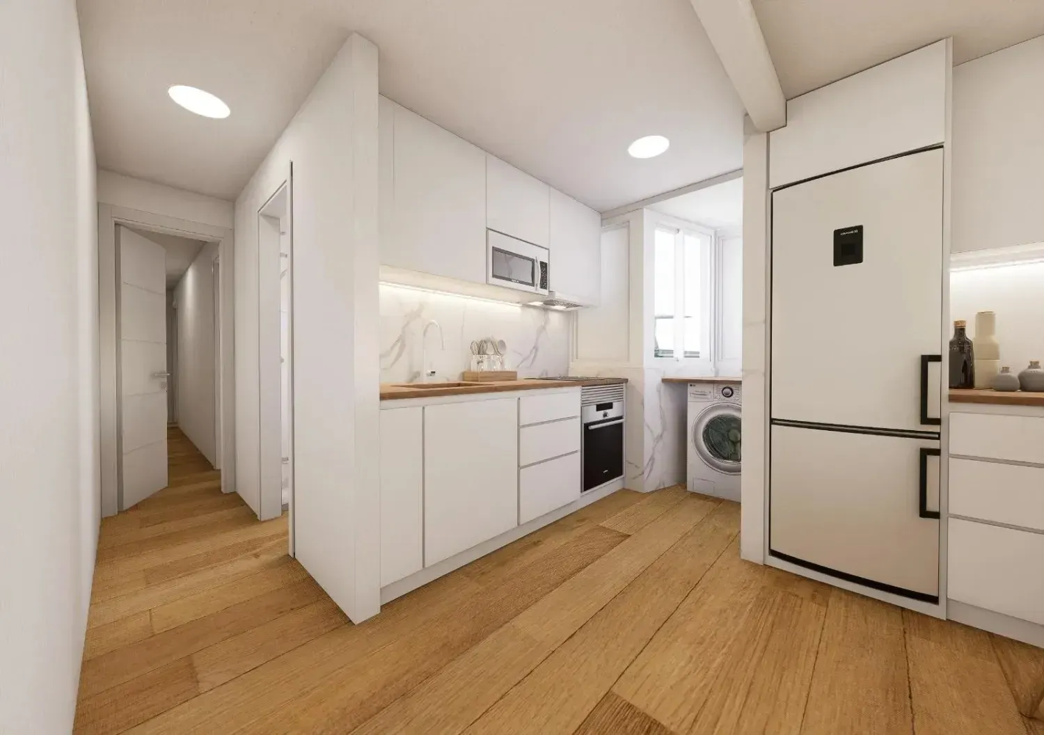 Cocina moderna, totalmente blanca, con suelos de madera clara, electrodomésticos integrados y lavadora junto al frigorífico.
