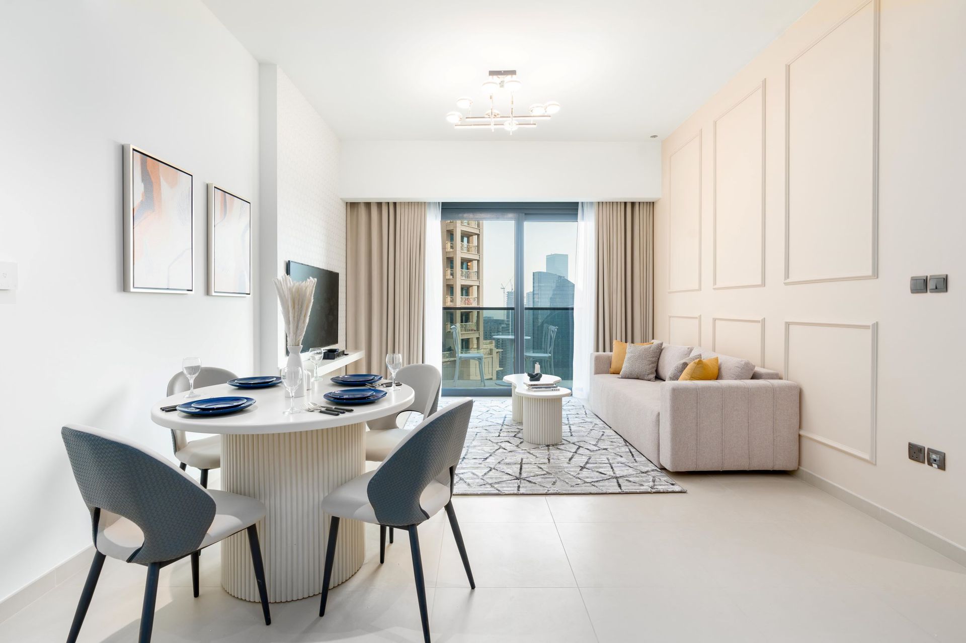A living room with a table and chairs and a couch
