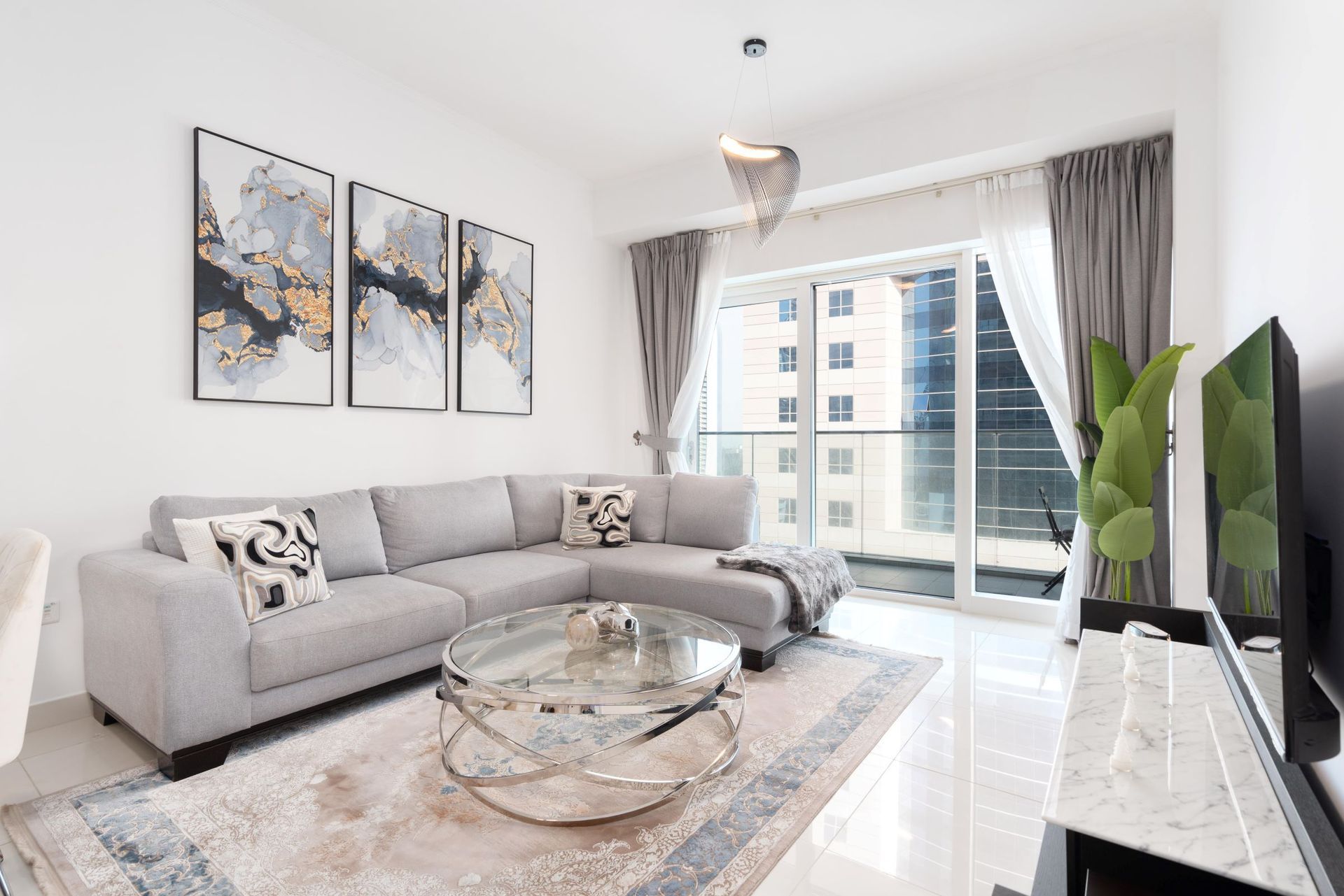 A living room with a couch and a television