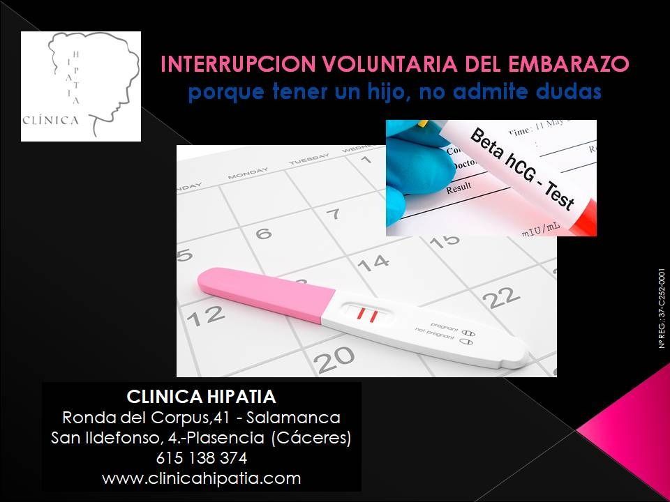Una prueba de embarazo está encima de un calendario.