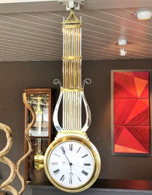 SWINGING CLOCK WITH DOUBLE DIAL BY DELORME A PARIS