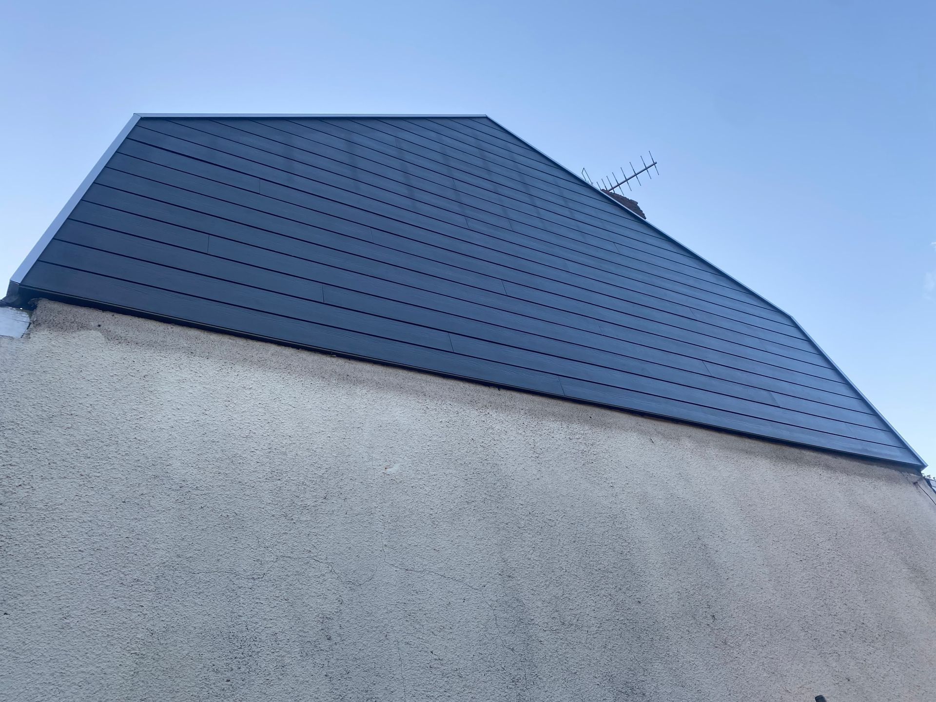Bardage sur une partie d'une façade