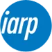 Un círculo azul con la palabra iarp escrita dentro de él.